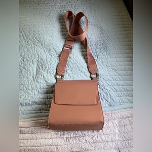 Crossbody universal thread bag, peachy color inside and out. New never used.